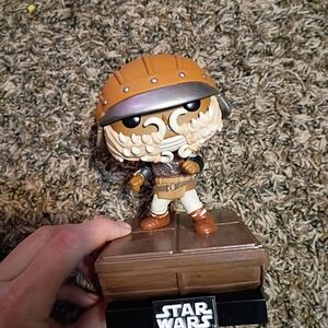 Star Wars Collectible Figure with Brown and Silver Accents